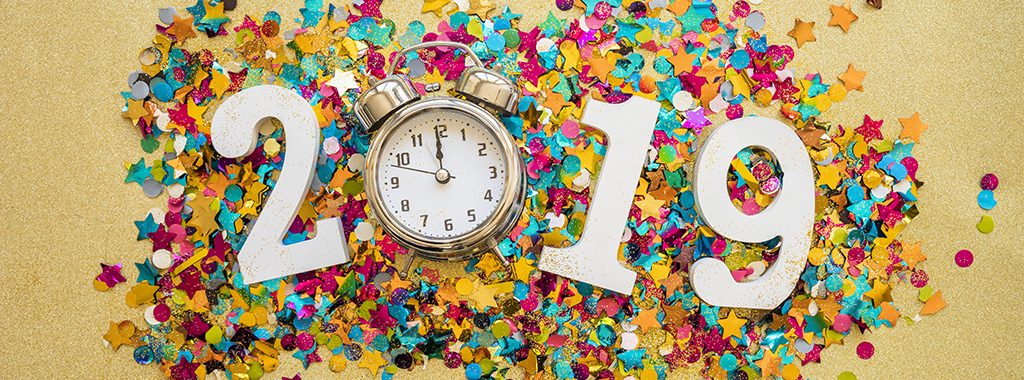 Image of 2019 with a clock and confetti. Celebrating a New Year.