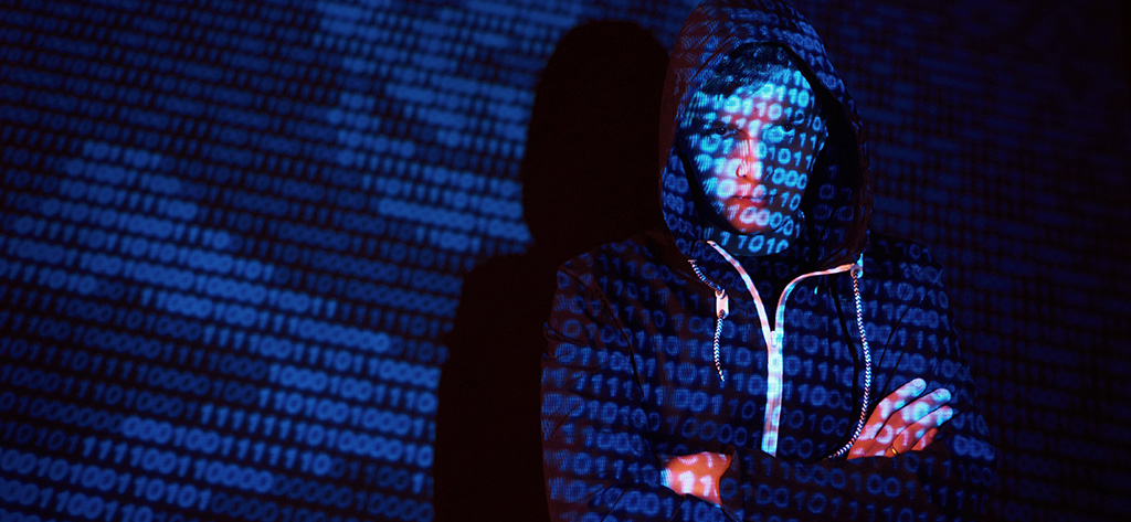 Cyber attack with unrecognizable hooded hacker using virtual reality, digital glitch effect.