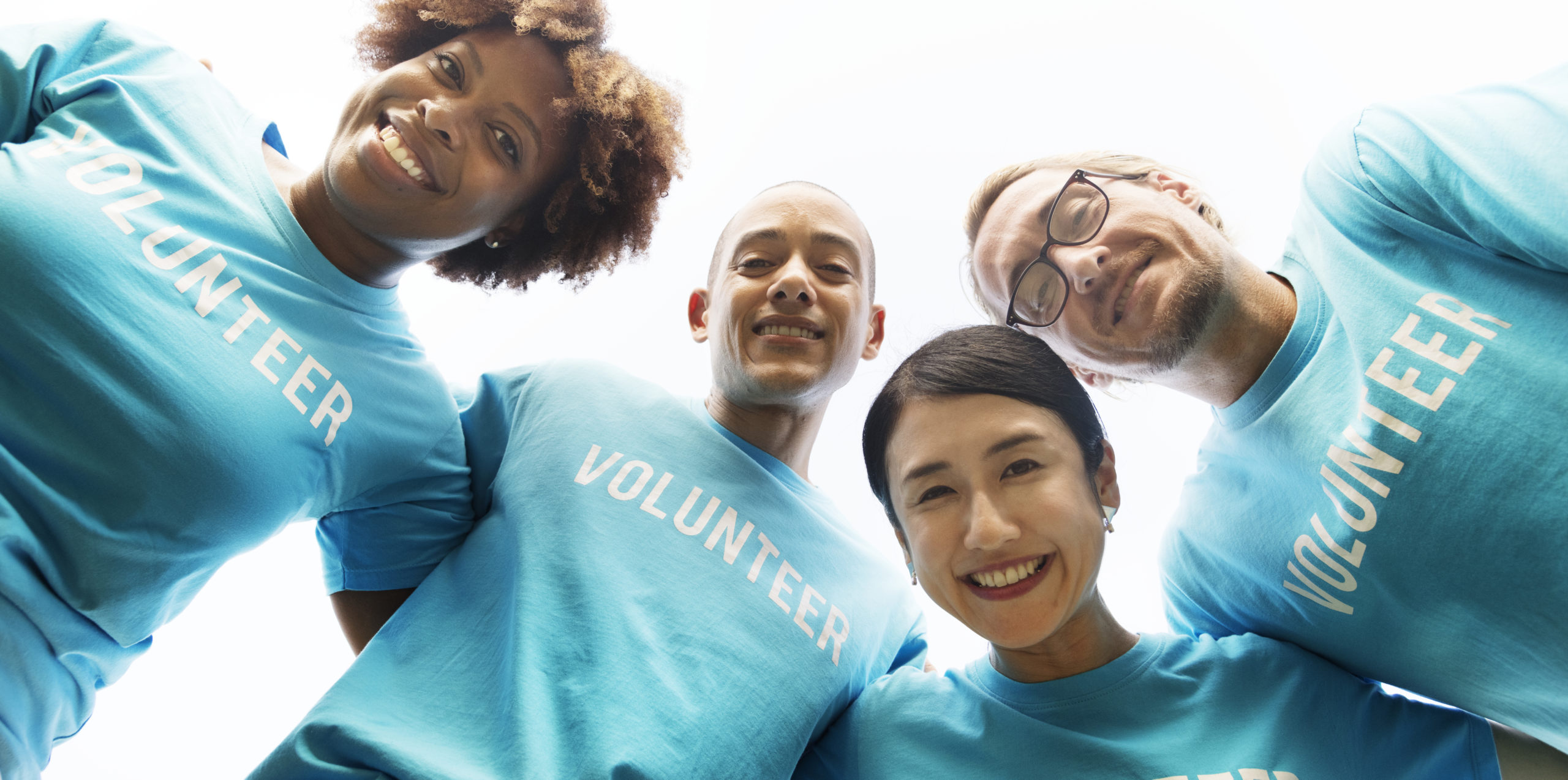 Group of happy and diverse volunteers